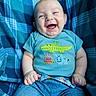 baby, blue, laughing, smiling, infant, child, plaid_blanket, cute, clothing, denim_shorts, happy, sitting, portrait, casual, hands, face, head, indoor, cute_animals, toddler