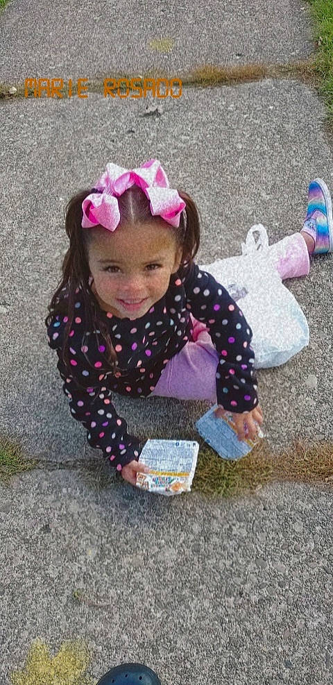 Yaneiris joined the competition — help win amazing prizes! asphalt, baby_toddler_clothing, child, clothing, flooring, fun, grass, happy, headgear, headwear, joy, leaf, magenta, mammal, pattern, person, pink, road_surface, sitting, sleeve