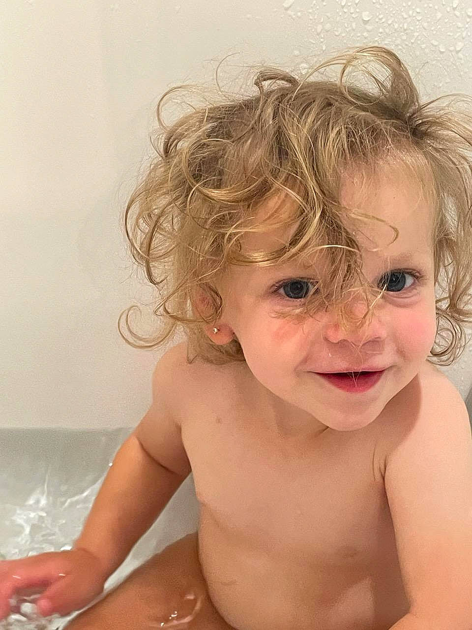 Stella is registered to the contest to win money with this photo: baby_bathing, bathing, bathroom, bathtub, brown_hair, cheek, chest, ear, eyebrow, eyelash, fun, happy, human_body, iris, joy, lip, neck, person, shoulder, smile