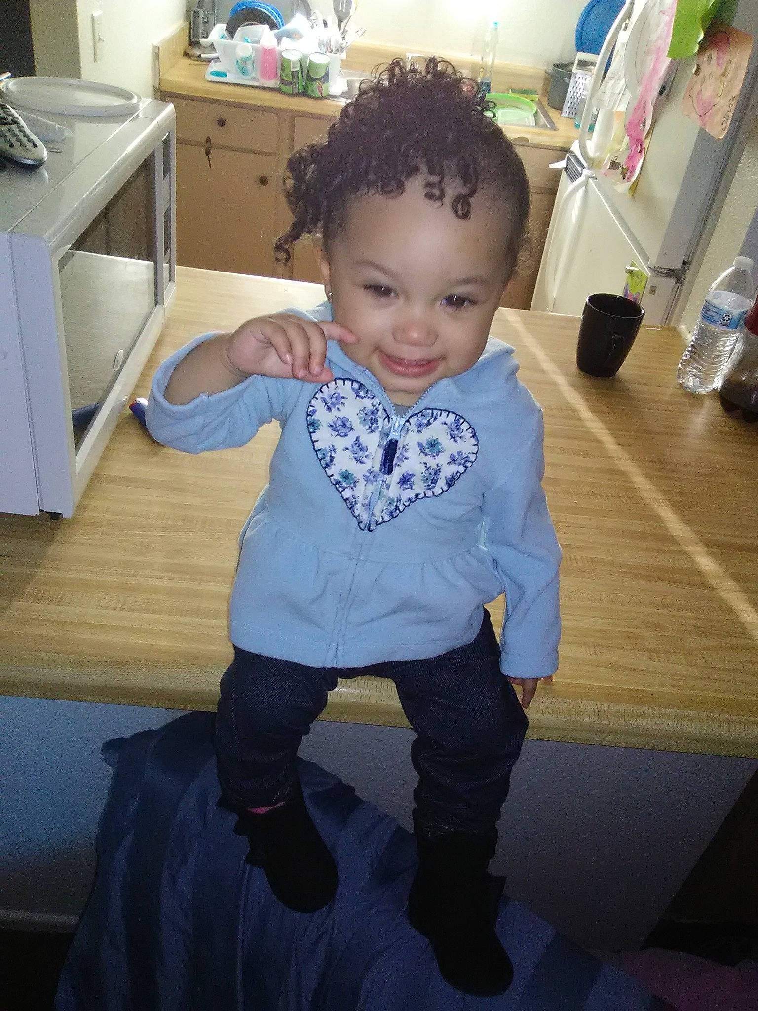 Alicea is registered to the contest to win money with this photo: arm, blue, boy, child, day, girl, hair, hairstyle, human_hair_color, infant, joy, outerwear, person, product, sitting, skin, standing, textile, toddler