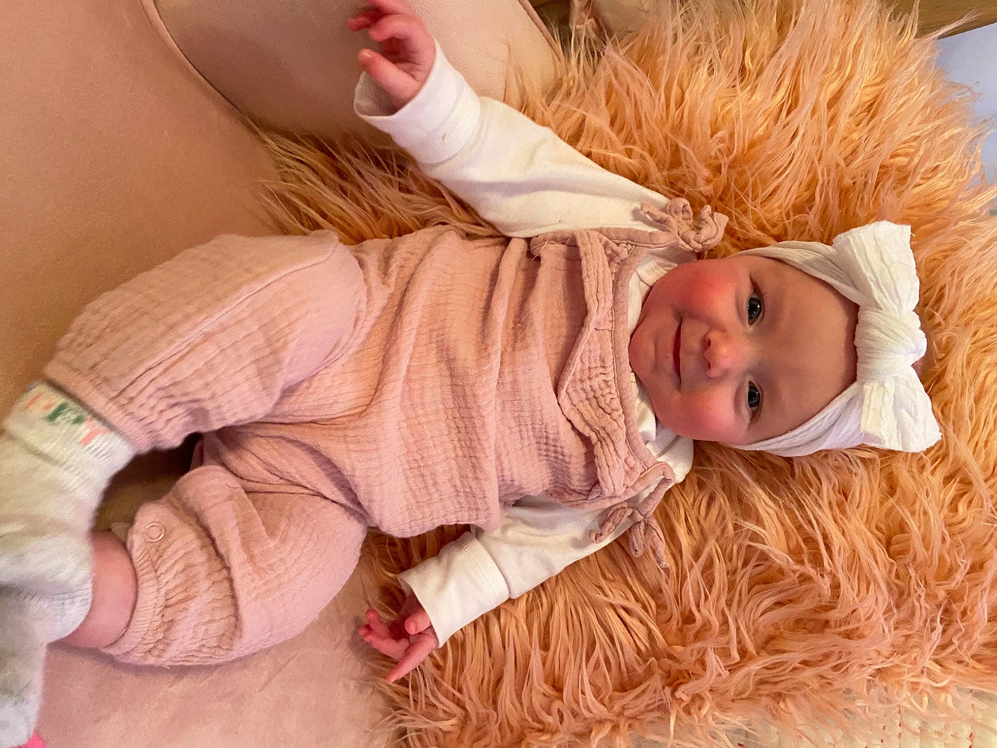 Harper joined the competition — help win amazing prizes! baby, baby_toddler_clothing, child, comfort, flooring, fur, grass, happy, hat, head, headwear, human_body, human_leg, knee, outerwear, person, skin, sleeve, textile, thigh