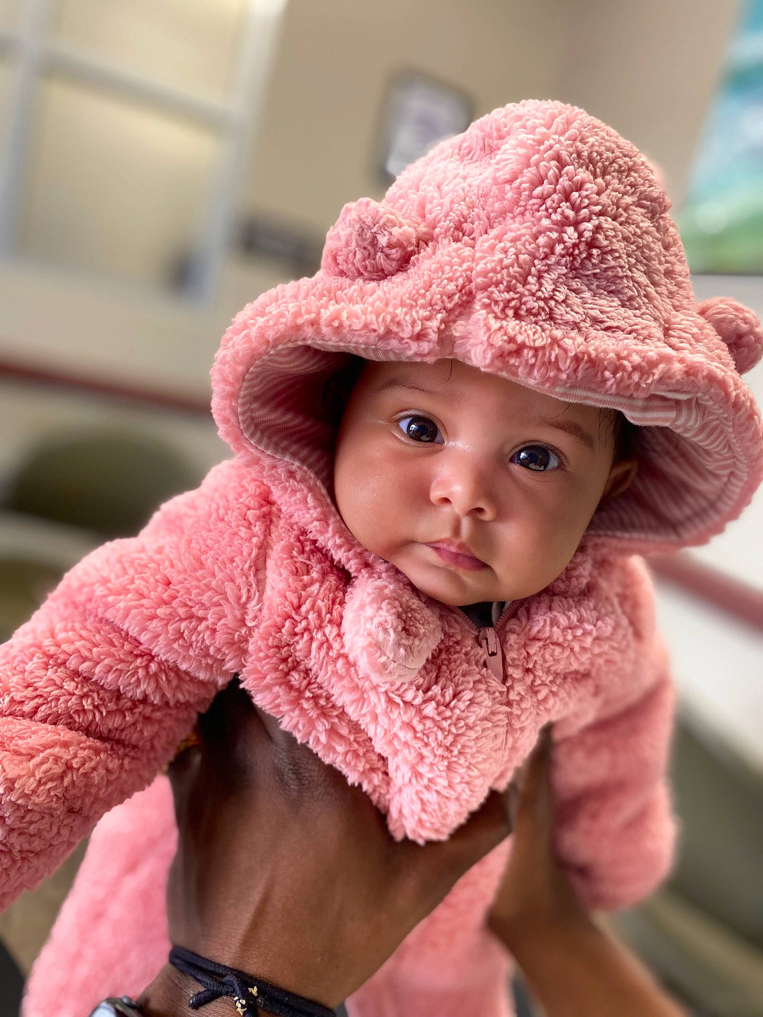 Saina is registered to the contest to win money with this photo: baby, cap, cheek, chin, eye, face, facial_expression, happy, hat, head, headwear, human_body, lip, mouth, nose, outerwear, person, pink, skin, sleeve