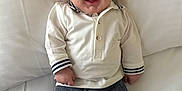 Kynoah joined the competition — help win amazing prizes! baby, smiling, infant, white_shirt, gray_pants, lying_down, bed, happy, cute, child, person, indoors, portrait, face, skin, head, clothing, sleeves, feet, comfort