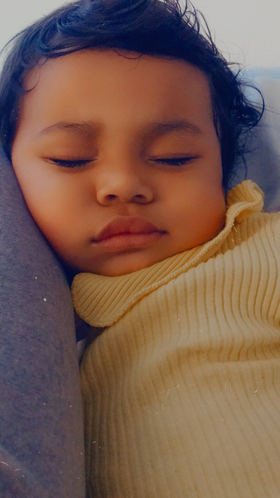 Carla is registered to the contest to win money with this photo: baby, beauty, brown_hair, cheek, child, comfort, eyebrow, eyelash, forehead, hair, happy, iris, linens, lip, nose, person, portrait_photography, skin, sleeve, toddler