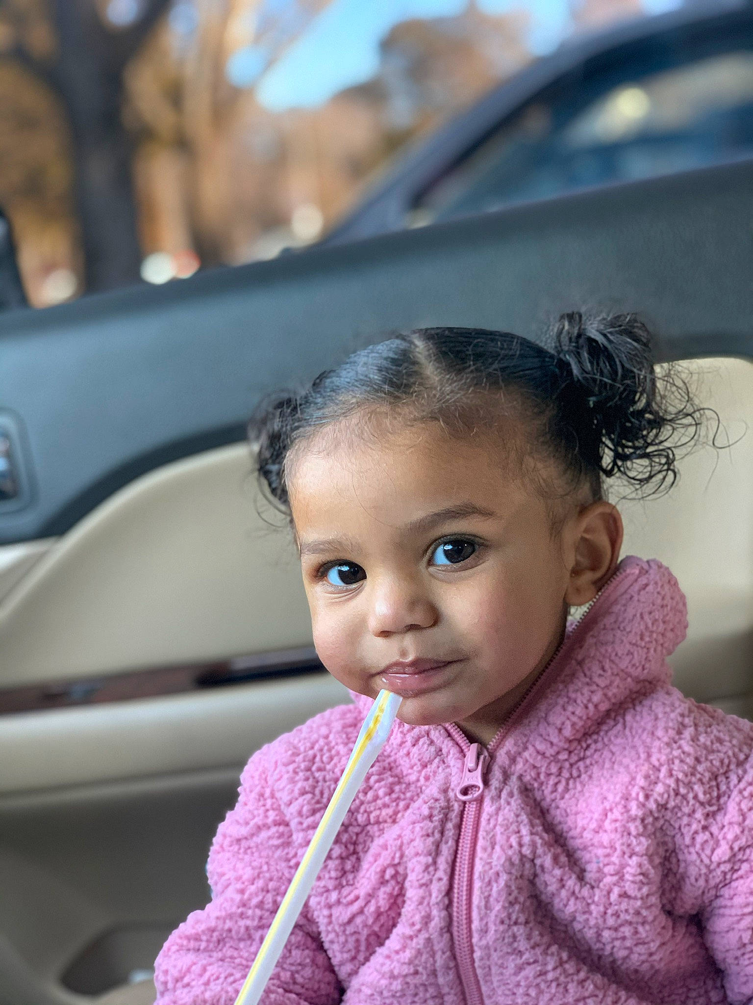 Talayah is registered to the contest to win money with this photo: automotive_design, automotive_exterior, automotive_lighting, automotive_mirror, black_hair, car, chin, eye, eyebrow, eyelash, facial_expression, happy, motor_vehicle, nose, outerwear, person, personal_luxury_car, skin, smile, toddler