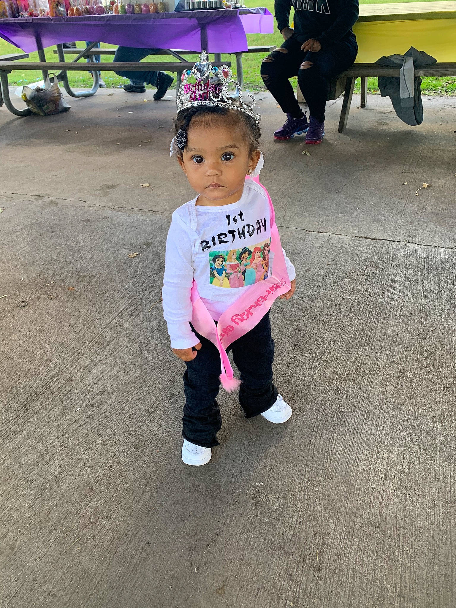 Talayah is registered to the contest to win money with this photo: asphalt, baby_toddler_clothing, bench, child, footwear, fun, happy, leg, leisure, pedestrian, person, pink, product, public_space, recreation, road_surface, sleeve, sneakers, t_shirt, tire