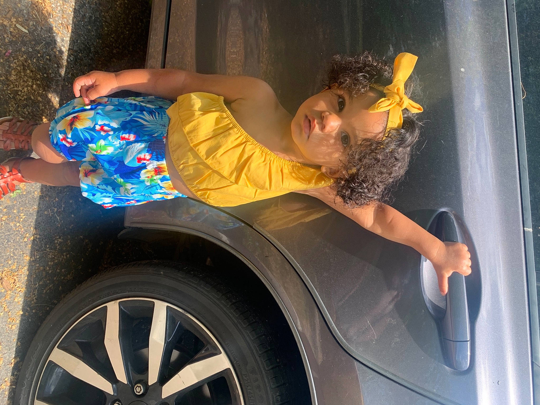 Talayah is registered to the contest to win money with this photo: alloy_wheel, automotive_design, automotive_exterior, automotive_lighting, automotive_tire, bumper, car, fender, hood, hubcap, motor_vehicle, person, personal_luxury_car, rim, smile, tints_and_shades, tire, vehicle, vehicle_door, wheel