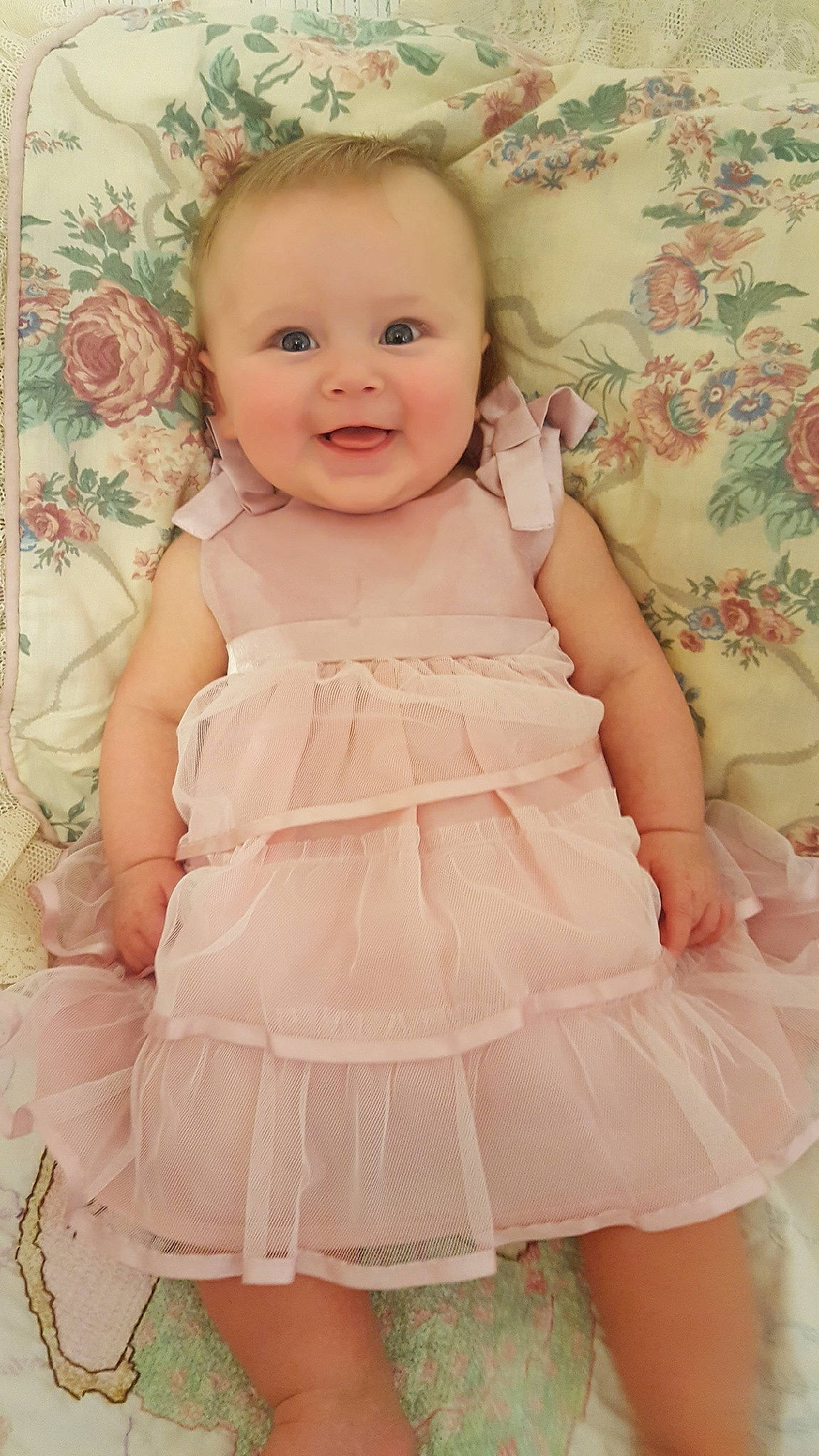 Karleigh joined the competition — help win amazing prizes! baby, baby_products, baby_toddler_clothing, cheek, child, child_model, clothing, dress, embellishment, pattern, peach, person, pink, product, ruffle, skin, textile, toddler