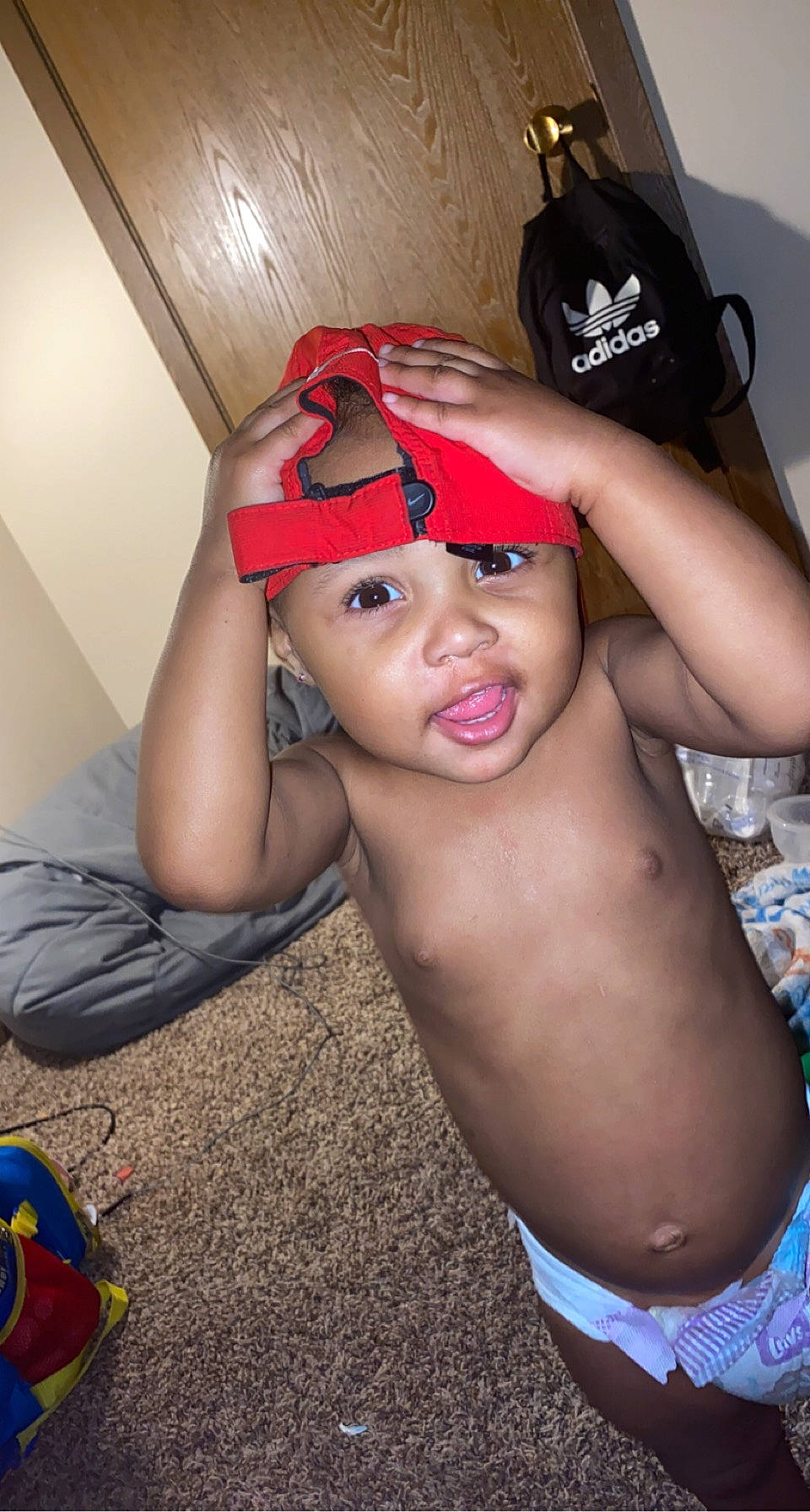 Iris is registered to the contest to win money with this photo: baseball_cap, cap, carmine, chest, child, elbow, eyebrow, eyewear, fashion_accessory, flash_photography, fun, happy, hat, headgear, headwear, lip, neck, person, personal_protective_equipment, sitting