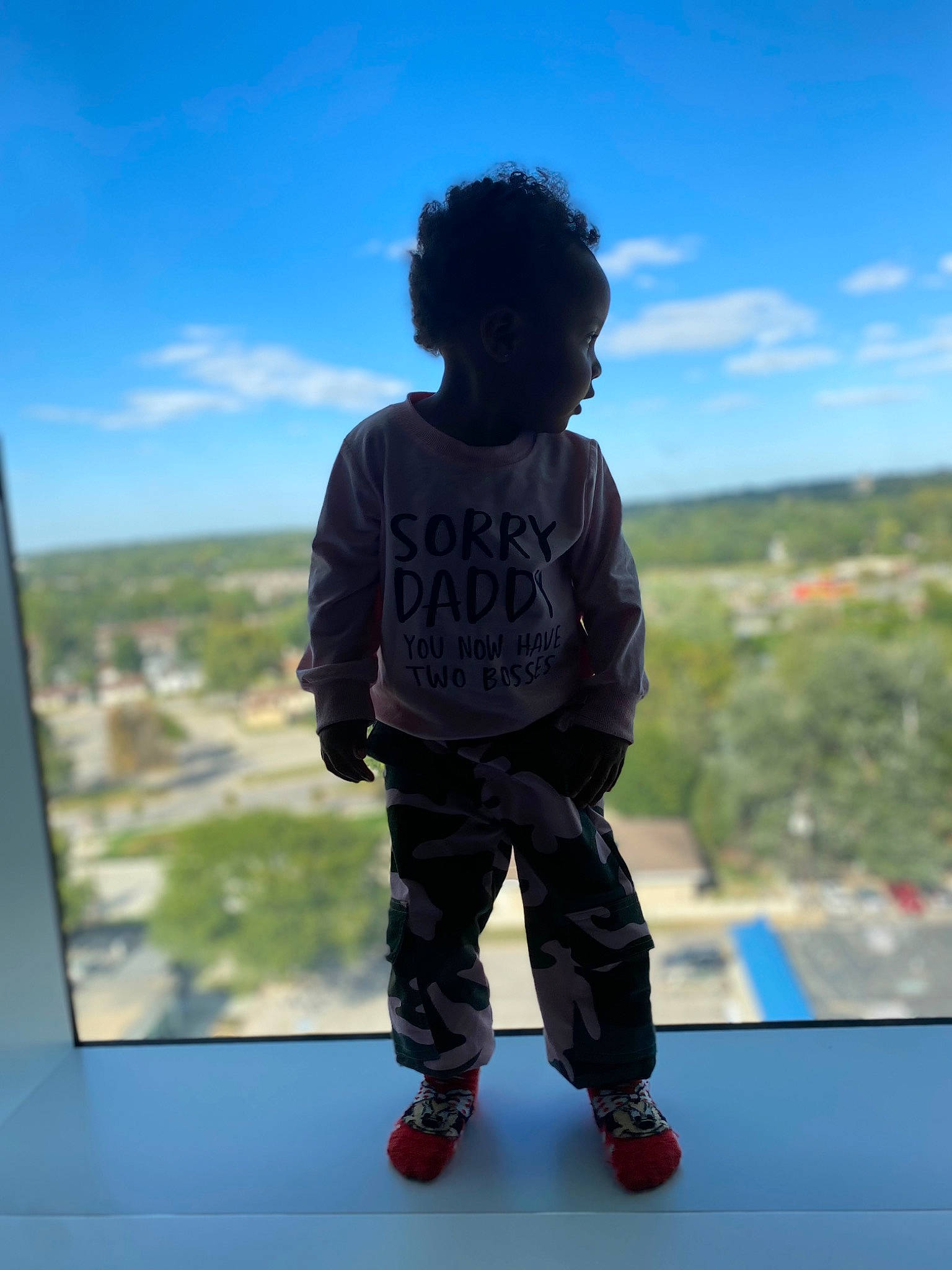 Iris is registered to the contest to win money with this photo: afro, child, cloud, cool, electric_blue, fun, happy, horizon, leisure, person, recreation, rolling, shadow, sky, sleeve, standing, t_shirt, toddler, tree, under_exposed