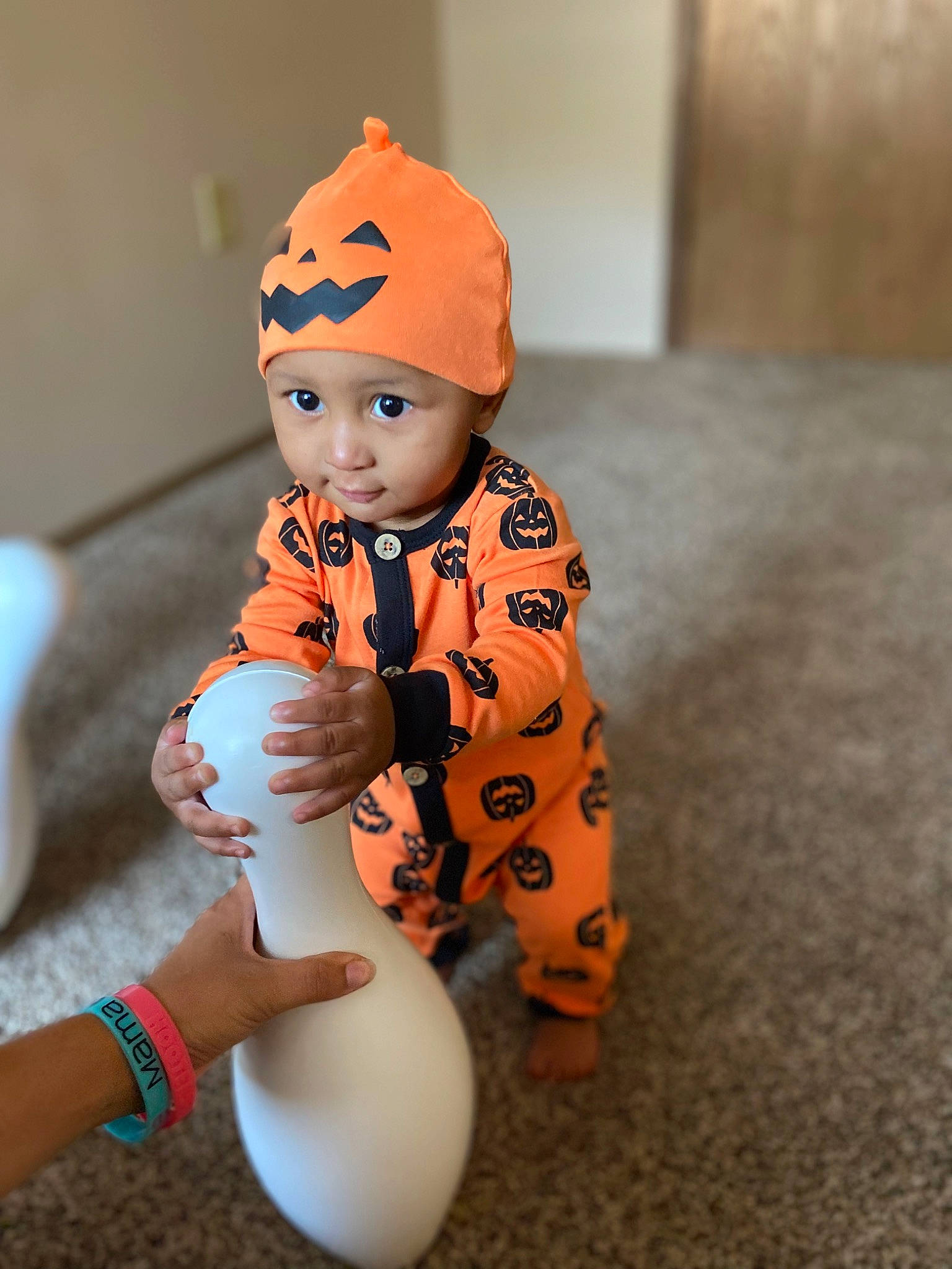 Damarious joined the competition — help win amazing prizes! baby, baby_toddler_clothing, cap, carmine, child, costume_hat, flooring, foot, gesture, happy, headwear, human_body, human_leg, knee, orange, person, personal_protective_equipment, sleeve, smile, thigh