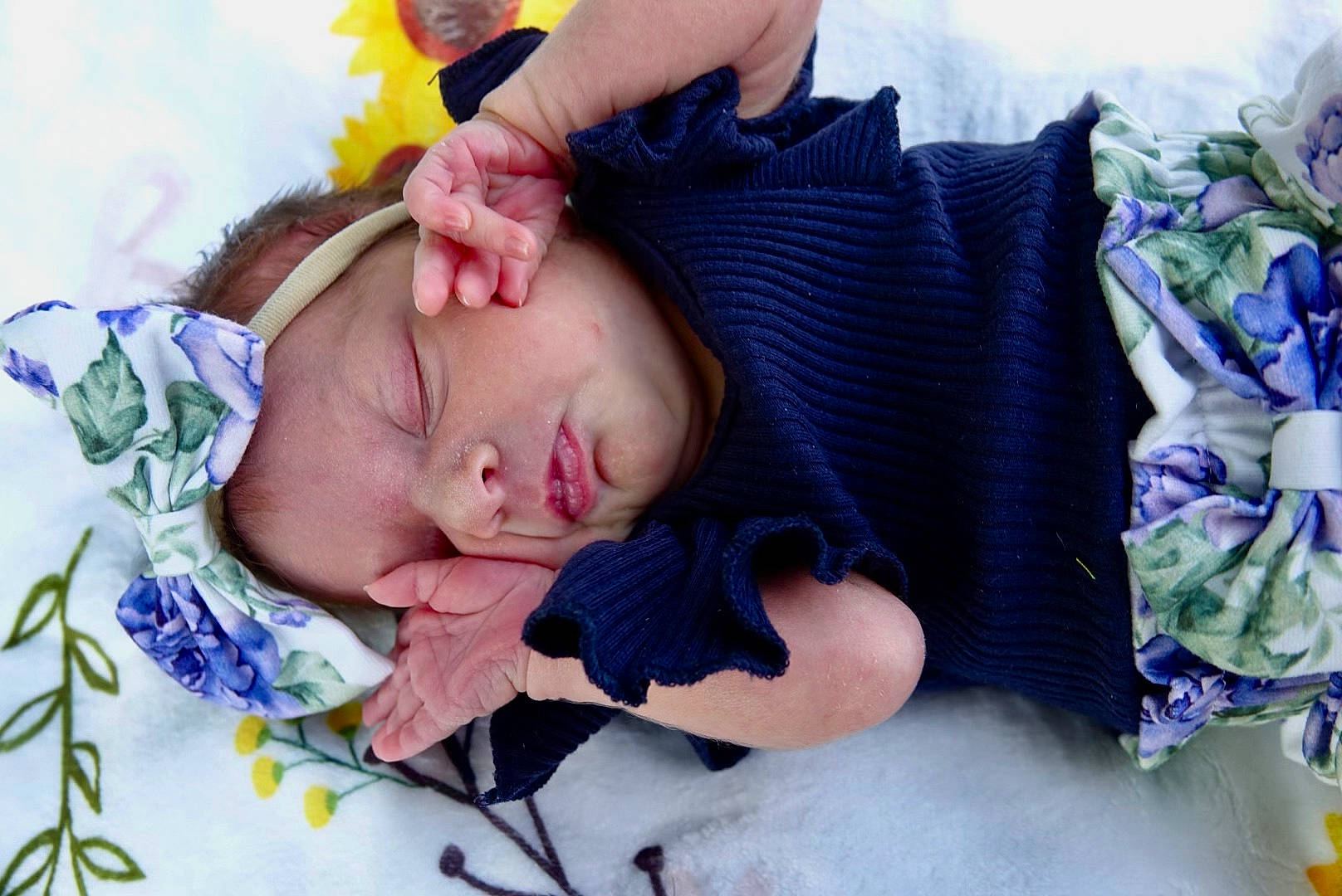 Piper is registered to the contest to win money with this photo: arm, baby, baby_products, baby_toddler_clothing, cheek, comfort, eye, face, finger, grass, hand, happy, head, linens, person, product, purple, skin, toddler, tree