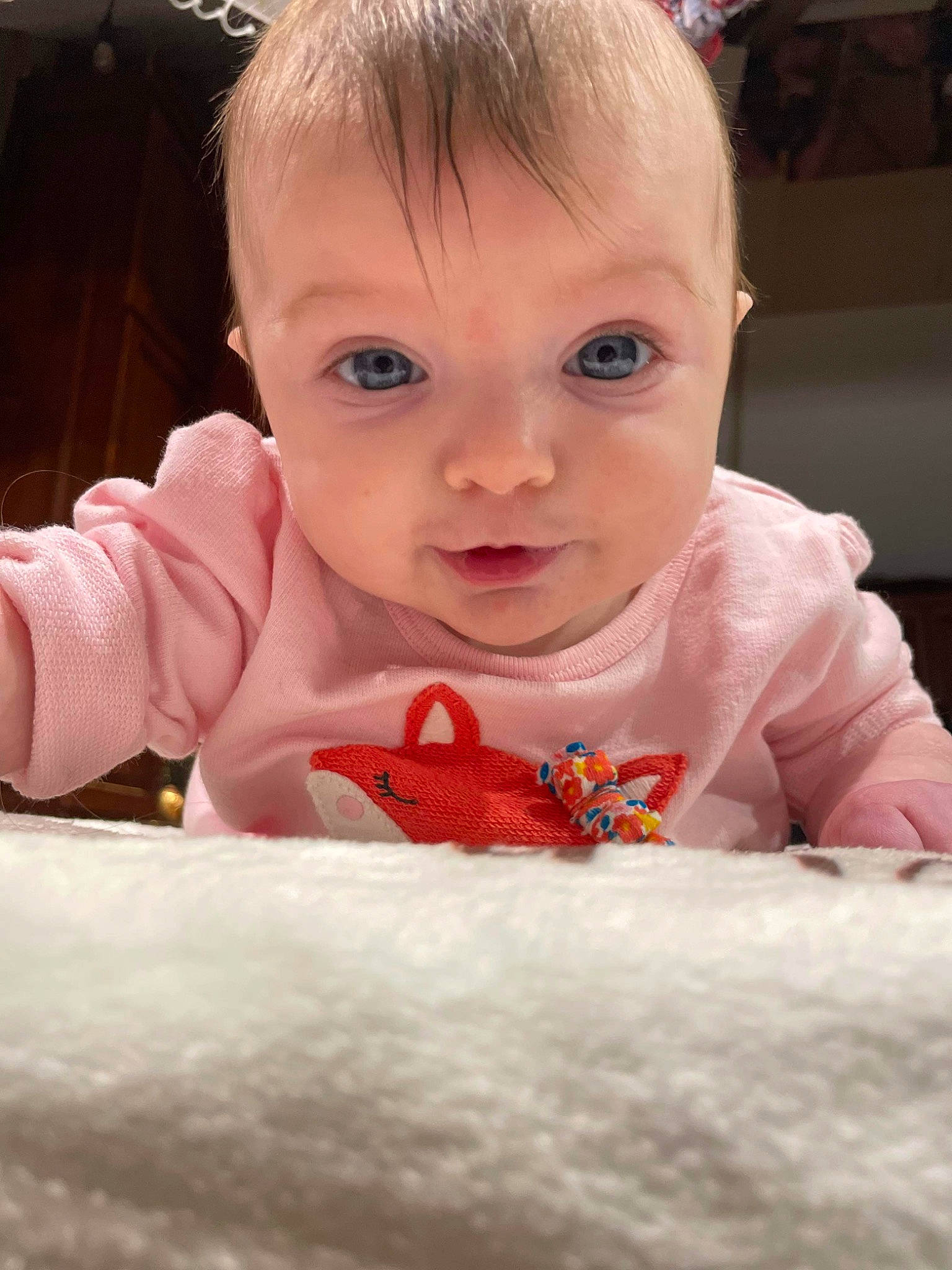 Piper is registered to the contest to win money with this photo: baby, baby_toddler_clothing, cheek, child, chin, eye, eyebrow, facial_expression, fun, hair, happy, iris, lip, mouth, nose, person, pink, skin, sleeve, toddler