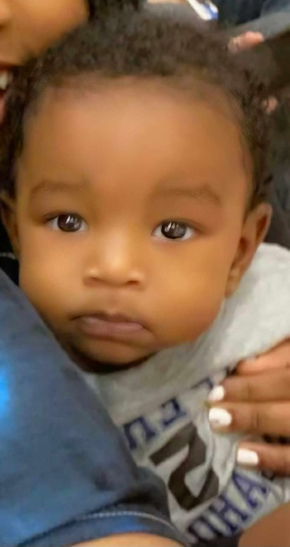 Akaiyo Keomani Knox is registered to the contest to win money with this photo: baby, close_up, face, child, eyes, hand, infant, portrait, skin, cute, person, clothing, young, expression, looking, cozy, holding, soft, adorable, indoors