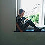 Aaron a rejoint le concours — aidez-le/la à gagner de superbes lots ! black_shirt, boy, camo_pants, casual_clothing, child, contemplative, daylight, indoor, minimalist, modern, natural_light, profile, quiet, relaxed, short_hair, sitting, sneakers, urban_view, window, windowsill
