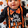 Noah a rejoint le concours — aidez-le/la à gagner de superbes lots ! baby, black, blanket, bow_tie, celebration, child, clothing, cute, face, festive, halloween, hat, holiday, infant, lying_down, orange, pattern, portrait, pumpkin, smiling