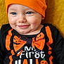 baby, background, black_clothing, blue_eyes, bow_tie, celebration, child, costume, cute, festive, halloween, happy, holiday, indoors, orange_clothing, orange_hat, portrait, pumpkin, smile, young_child