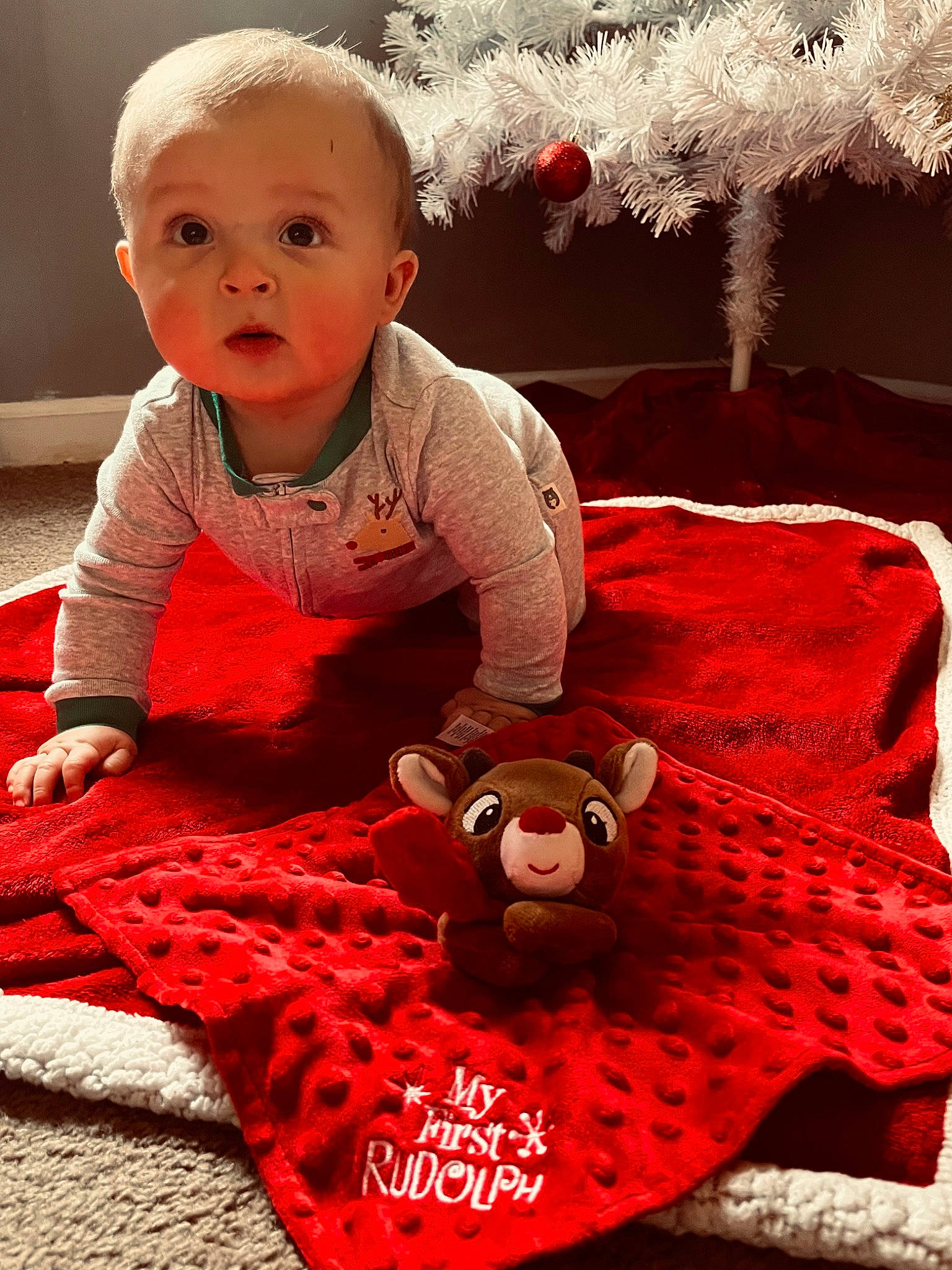 Brady is registered to the contest to win money with this photo: art, baby, baby_toddler_clothing, carmine, child, dress, event, eye, face, flooring, fun, happy, linens, pattern, person, pink, red, sitting, sleeve, surprise
