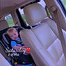 Braxley joined the competition — help win amazing prizes! toddler, child, car_seat, car_interior, seatbelt, beige_leather, window, greenery, blue_clothing, toy, red_toy, seat, headrest, safety, daytime, automobile, face, person, indoor, travel