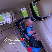 Braxley joined the competition — help win amazing prizes! toddler, child, car_seat, sleeping, interior, car, leather_seat, toy, blue_shirt, window, seatbelt, headrest, daytime, vehicle, safety, napping, child_seat, seat, baby, road_trip