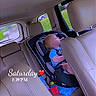 toddler, child, car_seat, sleeping, interior, car, leather_seat, toy, blue_shirt, window, seatbelt, headrest, daytime, vehicle, safety, napping, child_seat, seat, baby, road_trip