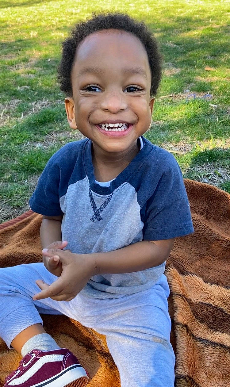 Masiah joined the competition — help win amazing prizes! adaptation, arm, child, community, facial_expression, finger, fun, grass, hand, happy, human, joy, leisure, people_in_nature, person, recreation, shorts, skin, smile, summer