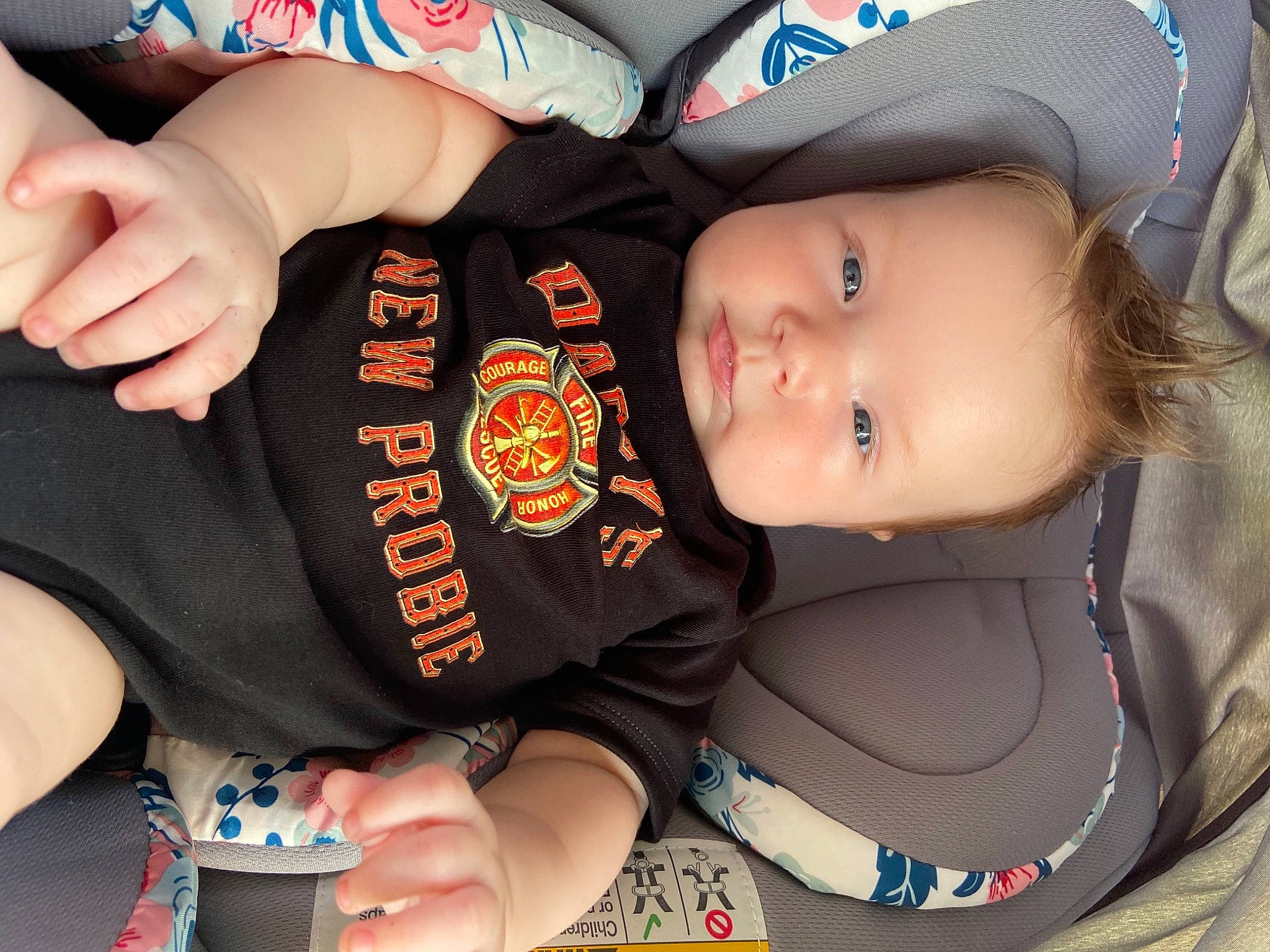 Lorelei is registered to the contest to win money with this photo: baby, baby_toddler_clothing, baseball_cap, blue, cap, child, cool, elbow, fashion_accessory, finger, fun, gesture, hand, hat, mouth, nail, person, sleeve, thumb, toddler