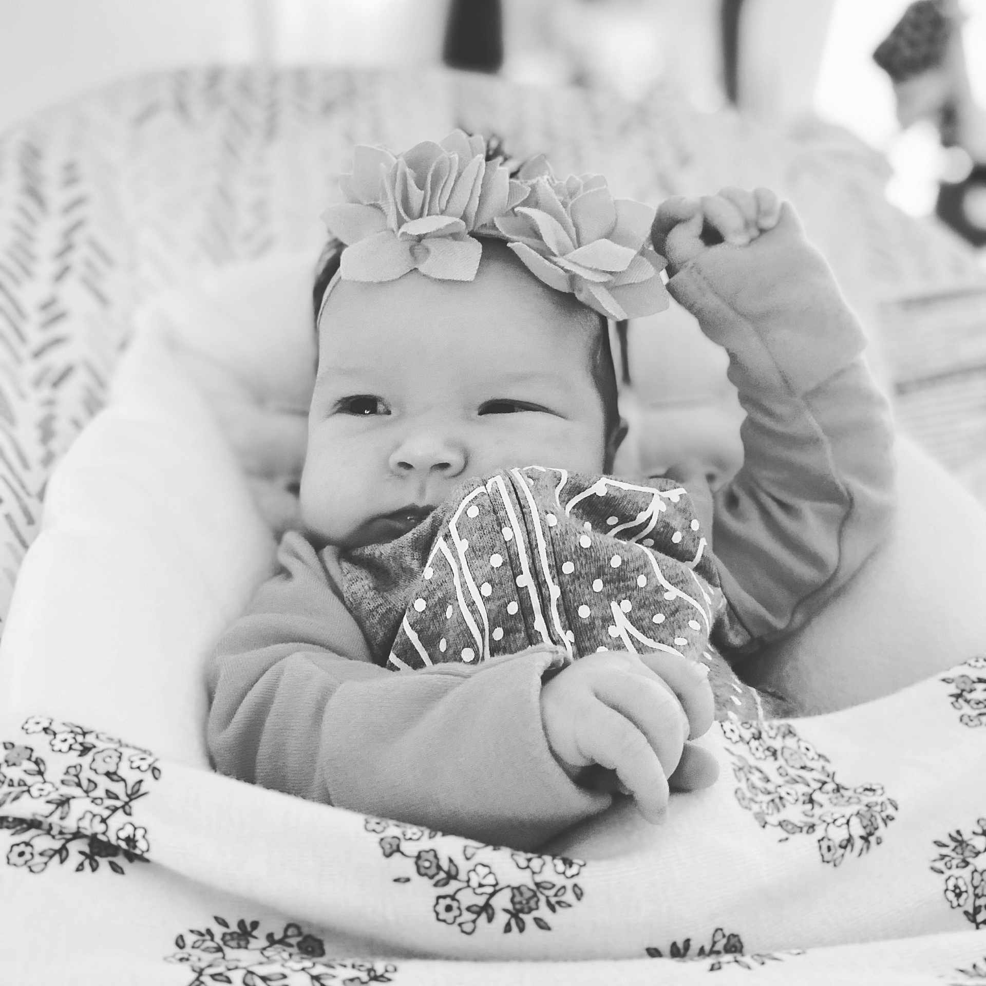 Lorelei is registered to the contest to win money with this photo: baby, baby_toddler_clothing, black_and_white, child, eyelash, finger, flash_photography, gesture, hairstyle, hand, happy, headband, headpiece, iris, monochrome, photograph, smile, style, toddler, white