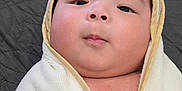 Jin is registered to the contest to win money with this photo: baby, infant, wrapped, blanket, face, closeup, cute, child, soft, portrait, indoors, newborn, sleeping_area, quilting, skin, head, young, cozy, comfort, peaceful