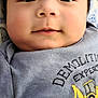 Jin joined the competition — help win amazing prizes! baby, child, face, closeup, smile, blue_shirt, demolition_expert, bulldozer, clothing, infant, cute, soft_blanket, indoors, portrait, young_child, person, head, eyes, nose, mouth