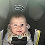 Paisley is registered to the contest to win money with this photo: baby, car_seat, infant, smiling, face, child, clothing, safety_harness, seat_belt, head_support, cute, portrait, indoors, child_safety, happy, person, soft_toys, onesie, baby_accessories, closeup