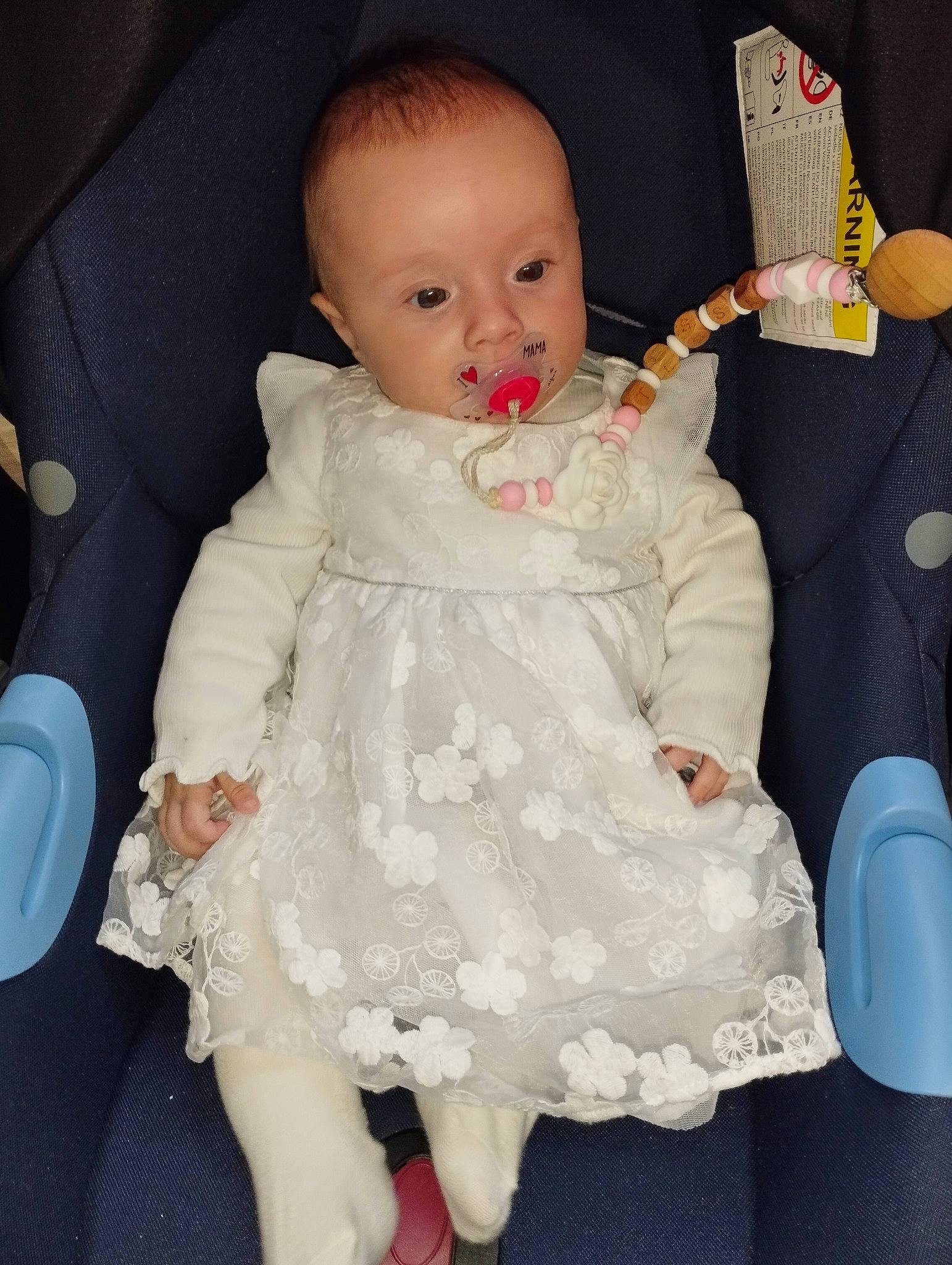 Tessa participe au concours pour gagner de l'argent avec cette photo : arm, baby, baby_toddler_clothing, cheek, child, comfort, dress, eye, face, finger, hair, hairstyle, hand, happy, head, human_body, person, skin, sleeve, textile