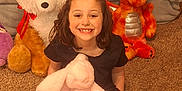 Saylor joined the competition — help win amazing prizes! child, clothing, costume, couch, cushion, face, female, furniture, girl, happy, head, homedecor, person, photography, plush, portrait, sitting, smile, teddybear, toy