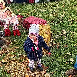 Saylor is registered to the contest to win money with this photo: baby_toddler_clothing, child, event, fun, grass, happy, hat, headwear, hoodie, leaf, pattern, people_in_nature, person, plant, play, recreation, soil, toddler, winter