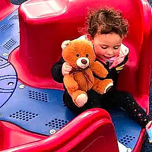 Saylor is registered to the contest to win money with this photo: child, comfort, font, happy, joy, lap, magenta, motor_vehicle, person, pink, plush, red, sitting, smile, snapshot, stuffed_toy, technology, teddy_bear, textile, toddler
