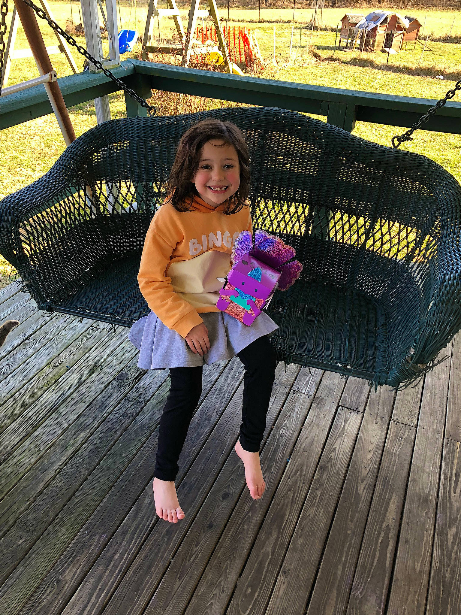 Saylor is registered to the contest to win money with this photo: beauty, bridge, deck, flash_photography, fun, grass, happy, hardwood, joy, leisure, magenta, outdoor_furniture, person, shoe, sitting, smile, snapshot, thigh, toddler, travel
