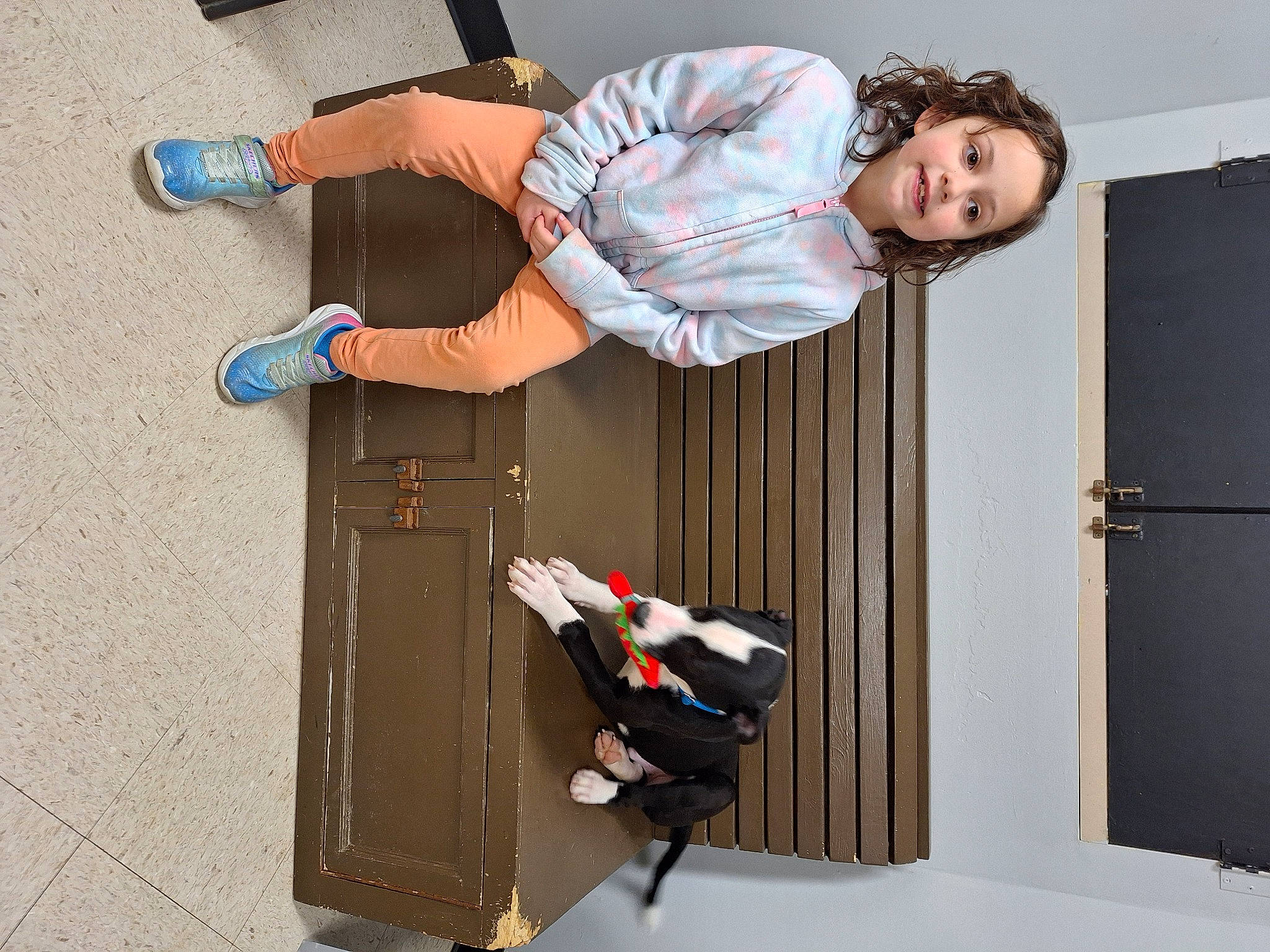 Saylor is registered to the contest to win money with this photo: curtain, denim, foot, human_leg, joy, knee, leg, outdoor_shoe, person, room, sandal, sitting, walking_shoe, white