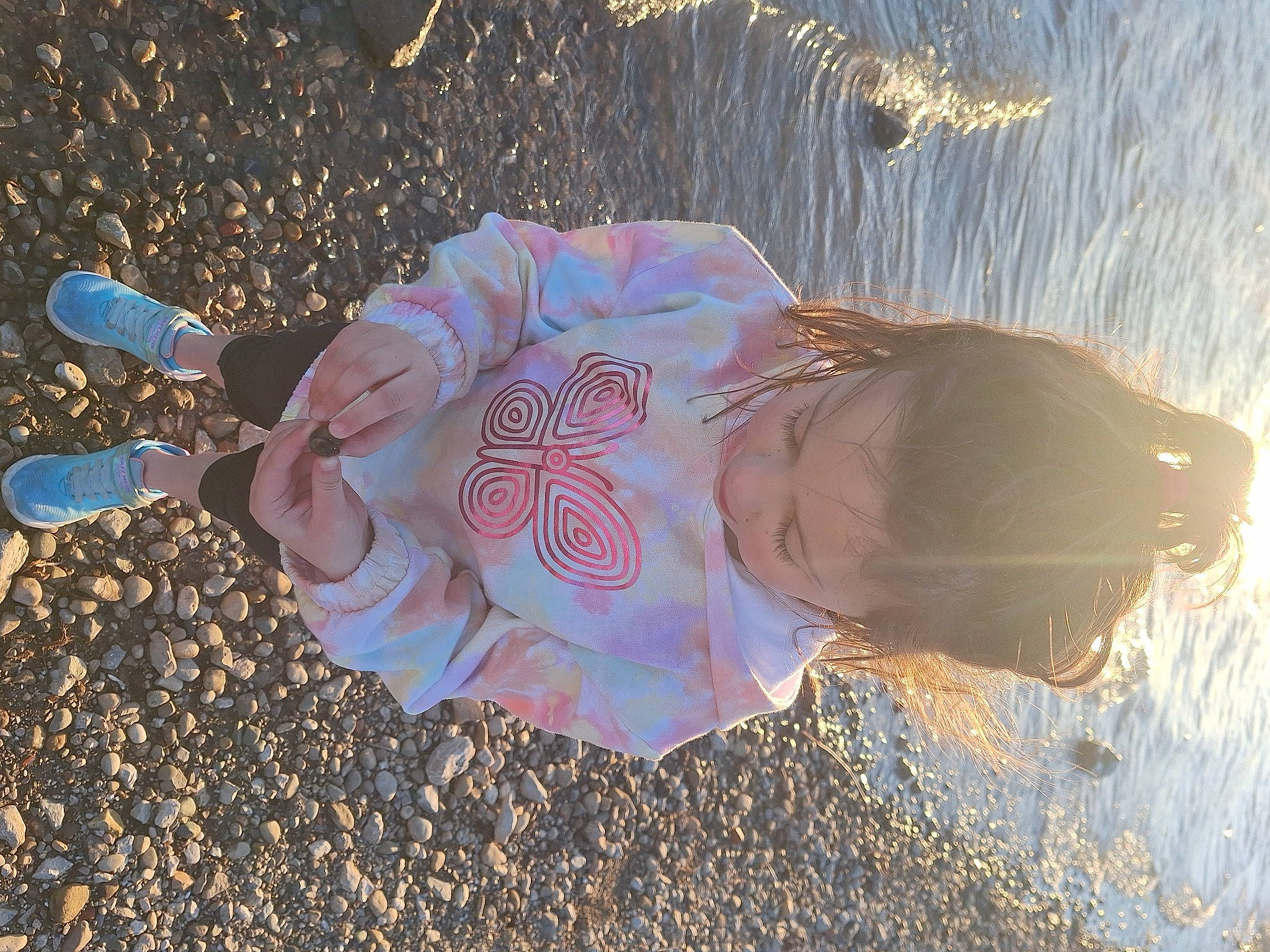 Saylor Kelli is registered to the contest to win money with this photo: beach, child, fashion_accessory, fun, grass, hat, human_leg, landscape, leisure, people_in_nature, person, recreation, sand, shadow, sky, soil, tints_and_shades, toddler, tree, water