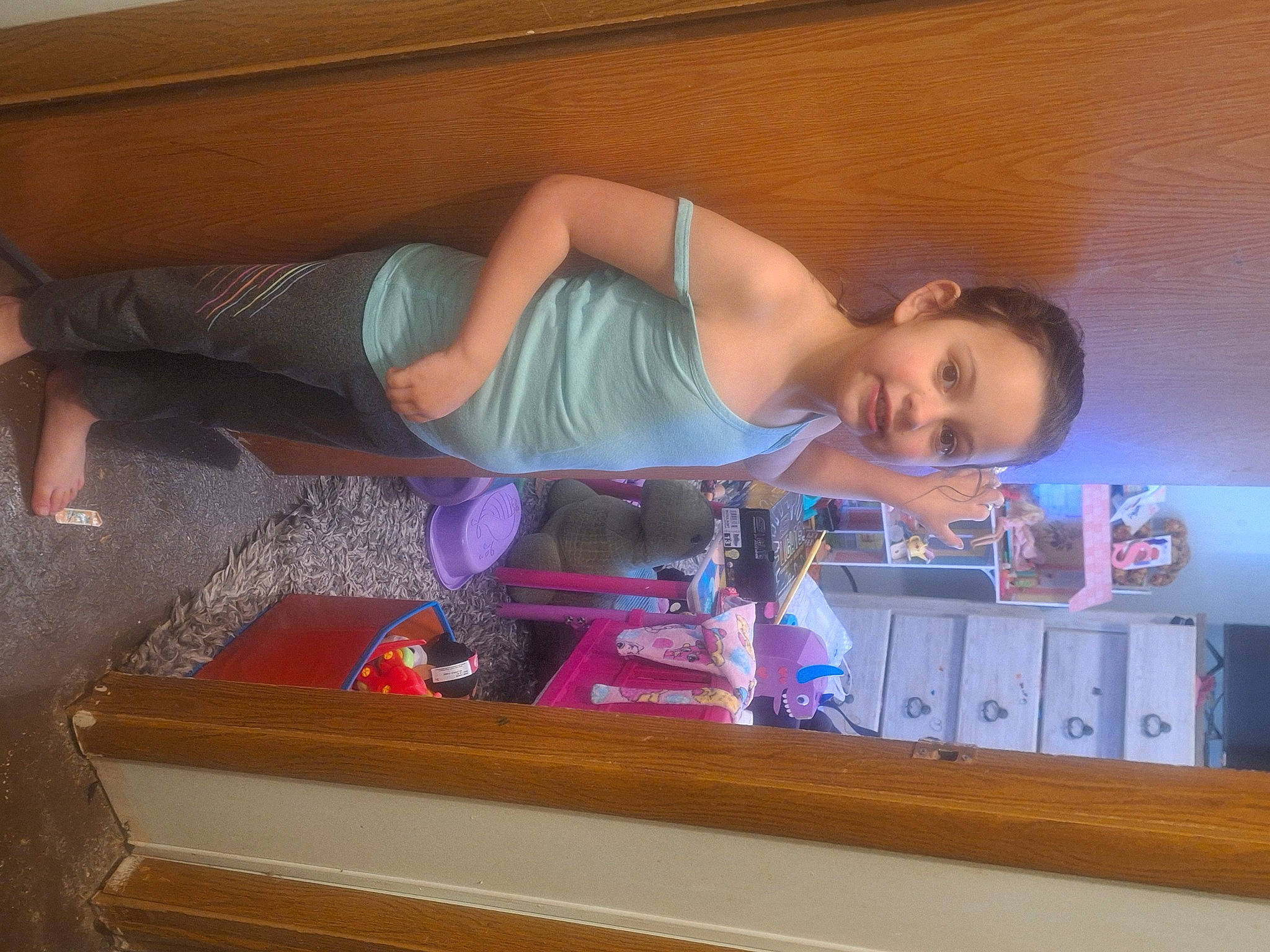 Saylor Kelli is registered to the contest to win money with this photo: chest, display_device, drawer, elbow, electric_blue, eyelash, fun, hair, hardwood, home_appliance, human_leg, joy, knee, person, room, shelving, sitting, smile, television_set, thigh