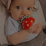 baby, baby_carrier, chewing, child, closeup, clothing, comfort, cute, eyes, fabric, face, hand, headband, indoor, infant, mushroom, polka_dot, portrait, soft_texture, toy