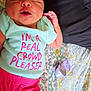 Ariya joined the competition — help win amazing prizes! baby, infant, sleeping, onesie, clothing, pink_shorts, blanket, patterned_blanket, purple_bow, face, head, hand, cheeky_text, lying_down, indoors, soft_lighting, newborn, cute, peaceful, resting
