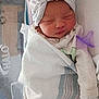 Ariya is registered to the contest to win money with this photo: newborn, baby, sleeping, hospital, blanket, swaddled, head_wrap, pacifier, infant, bed, cozy, cute, wrapped, person, indoors, soft, peaceful, child, rest, healthcare