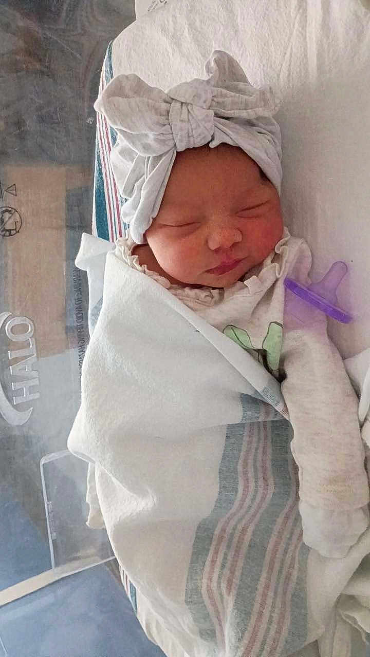 Ariya is registered to the contest to win money with this photo: newborn, baby, sleeping, hospital, blanket, swaddled, head_wrap, pacifier, infant, bed, cozy, cute, wrapped, person, indoors, soft, peaceful, child, rest, healthcare