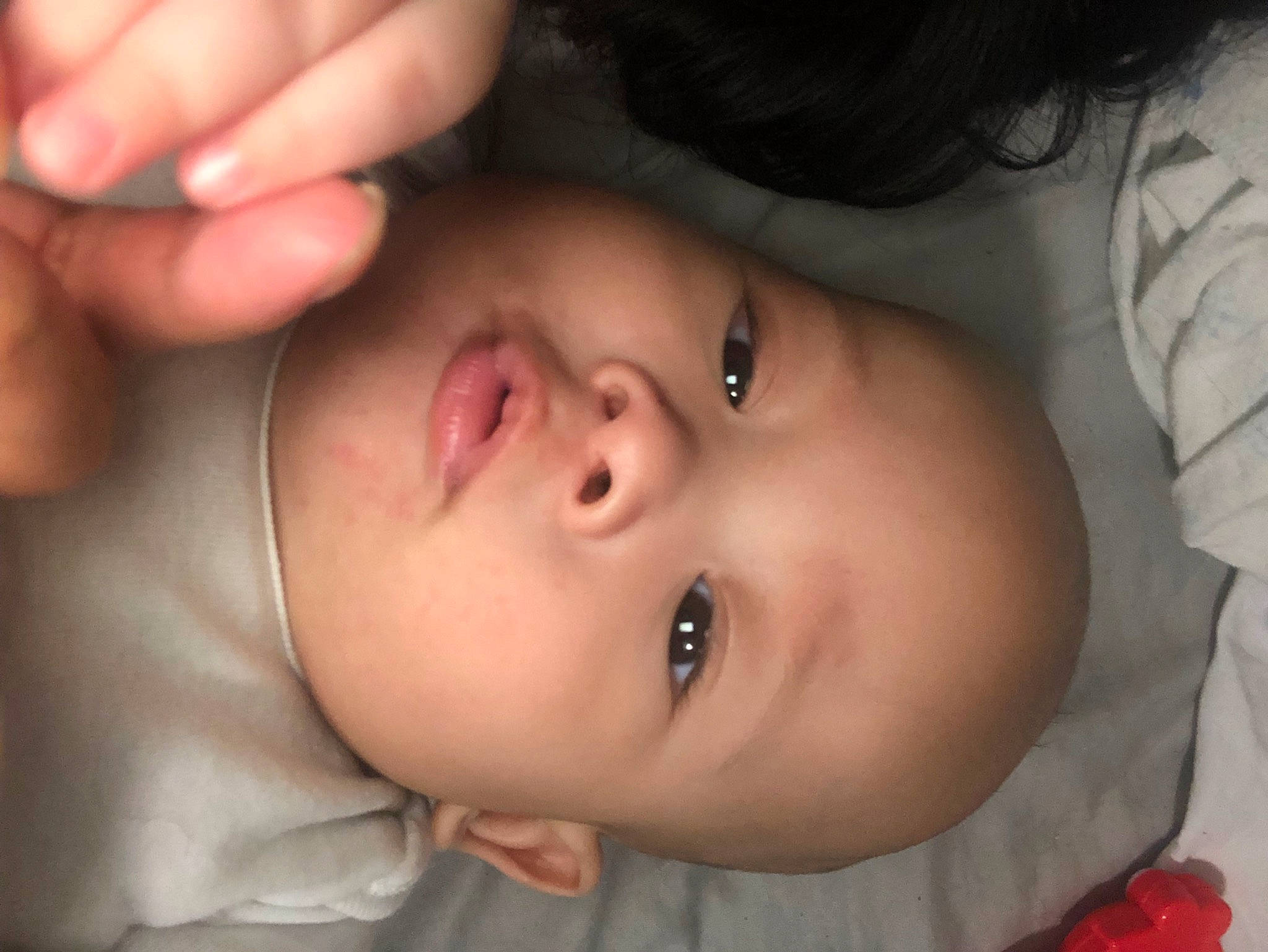 Kai is registered to the contest to win money with this photo: baby, cheek, chin, ear, eyebrow, eyelash, finger, flash_photography, forehead, gesture, hand, happy, human_body, iris, lip, mouth, nose, person, skin, smile