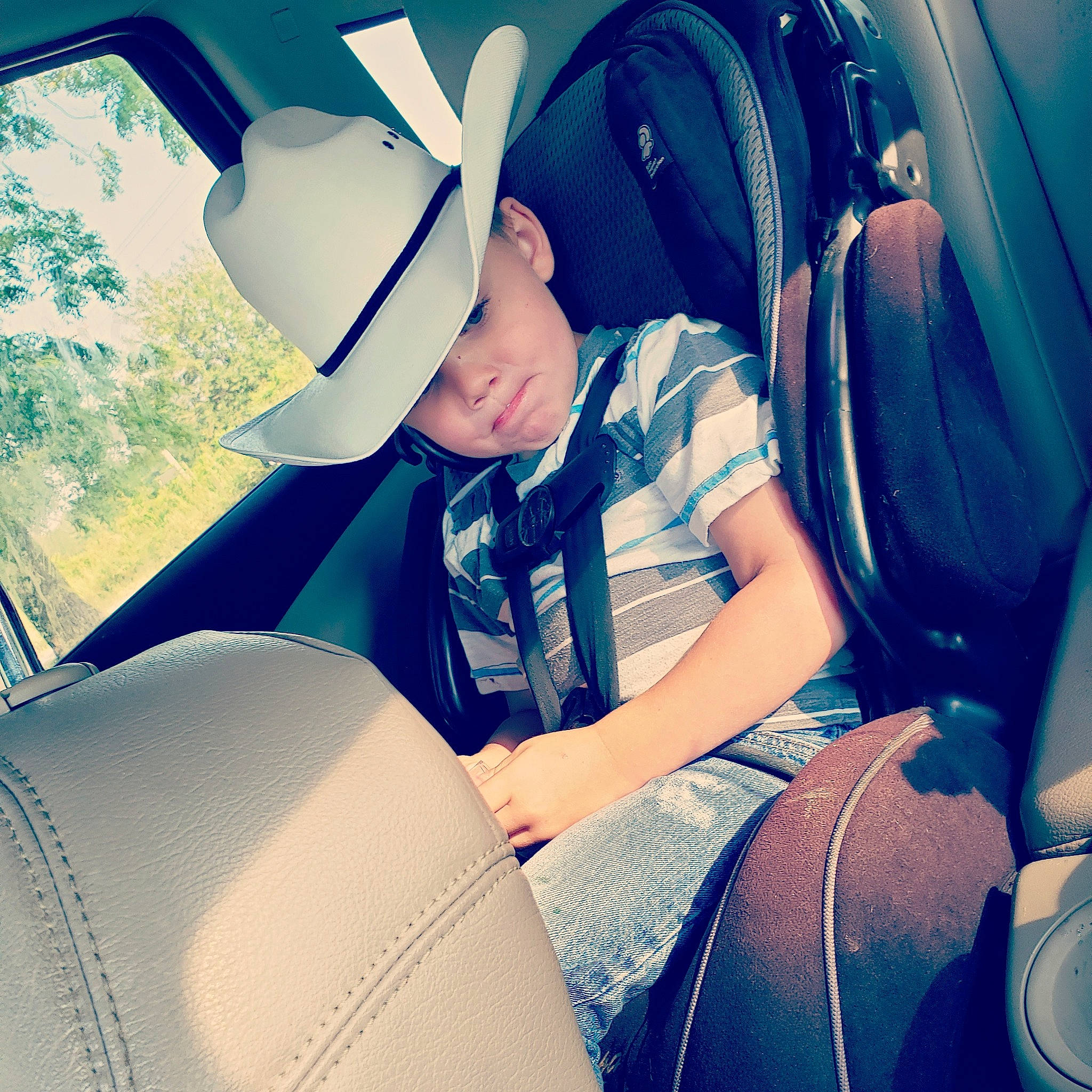 Hurley joined the competition — help win amazing prizes! airline, auto_part, cap, car, car_seat, car_seat_cover, child, comfort, cool, family_car, head_restraint, headgear, headwear, passenger, person, photography, seat_belt, selfie, sitting, vacation