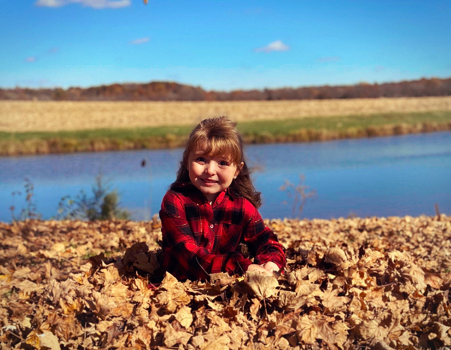 Peyton is registered to the contest to win money with this photo: autumn, bank, child, fun, happy, joy, lake, landscape, leaf, person, photography, plant, play, reflection, sand, sky, smile, soil, toddler, tree