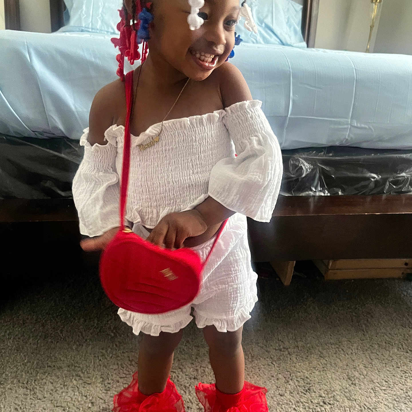 Aveah Lawrence is registered to the contest to win money with this photo: ball, child, clothing, couch, face, female, football, footwear, furniture, girl, head, person, photography, portrait, shoe, shorts, sitting, soccer, soccerball, sport