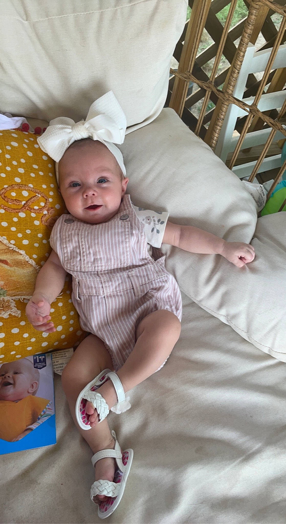 Arabella joined the competition — help win amazing prizes! baby, baby_products, baby_toddler_clothing, chair, child, comfort, couch, happy, human_leg, leg, linens, pattern, person, pink, room, sitting, skin, sock, thigh, toddler