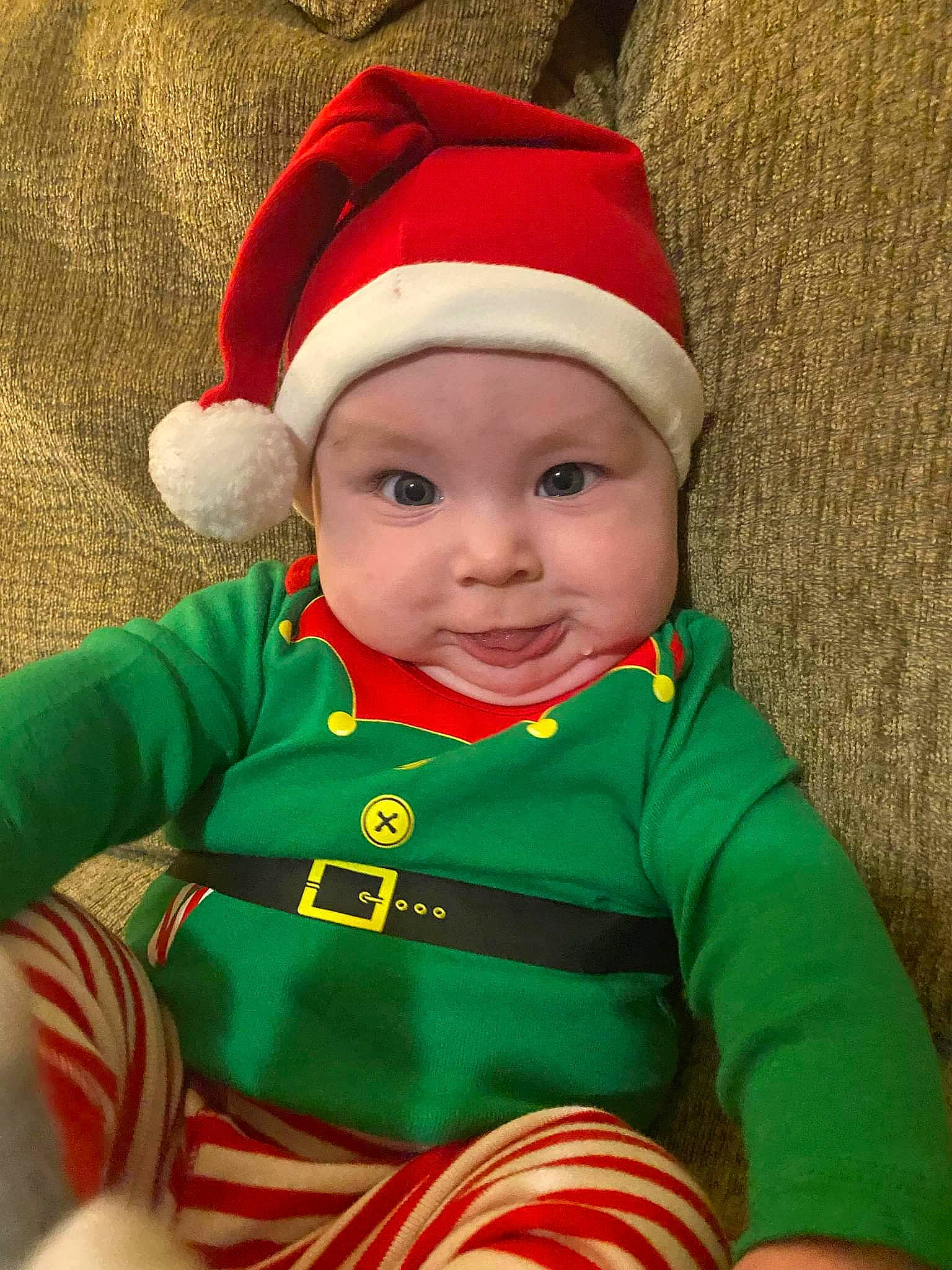 Colson joined the competition — help win amazing prizes! baby, baby_toddler_clothing, cap, christmas_ornament, costume_hat, event, eye, fictional_character, grass, happy, hat, head, headwear, holiday, human_body, jacket, outerwear, person, sleeve, smile