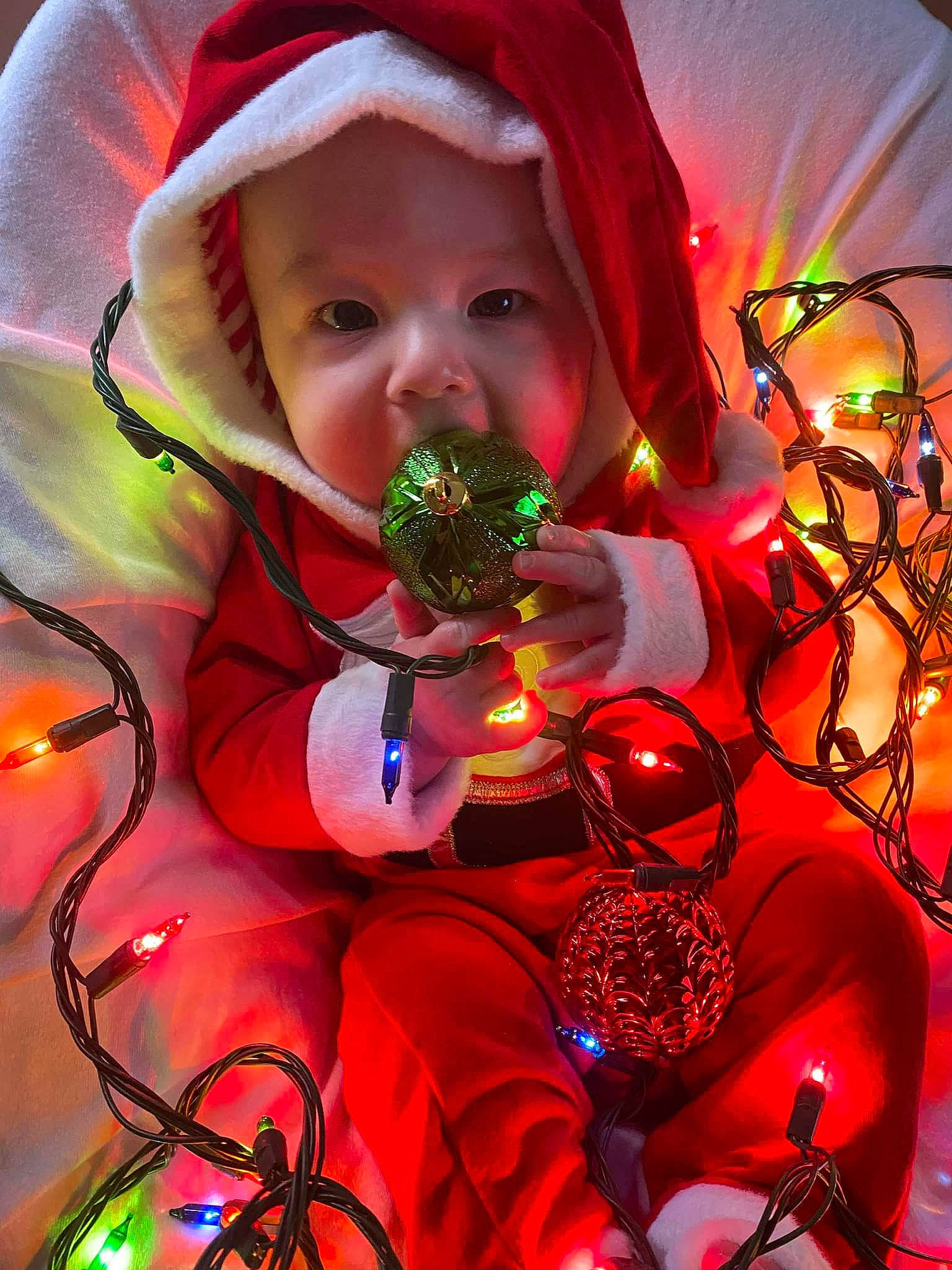 Colson is registered to the contest to win money with this photo: beauty, christmas, christmas_decoration, christmas_eve, christmas_ornament, event, fun, happy, headwear, holiday, holiday_ornament, light, lighting, magenta, nature, organism, ornament, person, purple, red